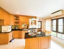 Bright modern kitchen with central island and wooden cabinets