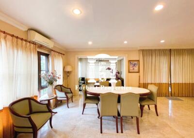 Elegant dining area with ample seating and natural light