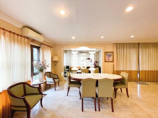 Elegant dining area with ample seating and natural light