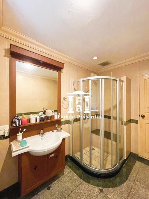 Spacious bathroom with sink and shower