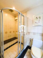 Clean and bright bathroom with enclosed shower