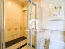 Clean and bright bathroom with enclosed shower