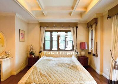 Comfortable and elegant bedroom with coffered ceiling