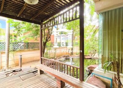 Outdoor patio with wooden deck and pergola