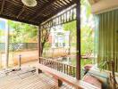 Outdoor patio with wooden deck and pergola