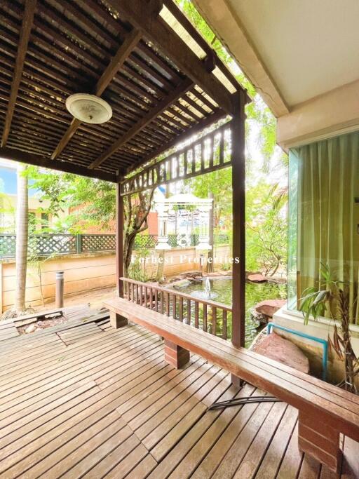 Outdoor patio with wooden deck and pergola