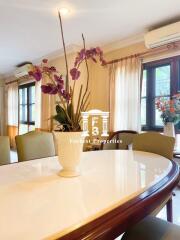 Bright dining room with a large table and elegant decor