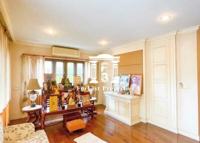 Living room with wooden floors and multiple light fixtures