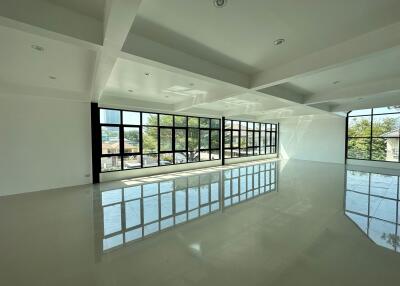 Spacious living area with large windows