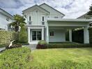 Modern two-story house with a front lawn