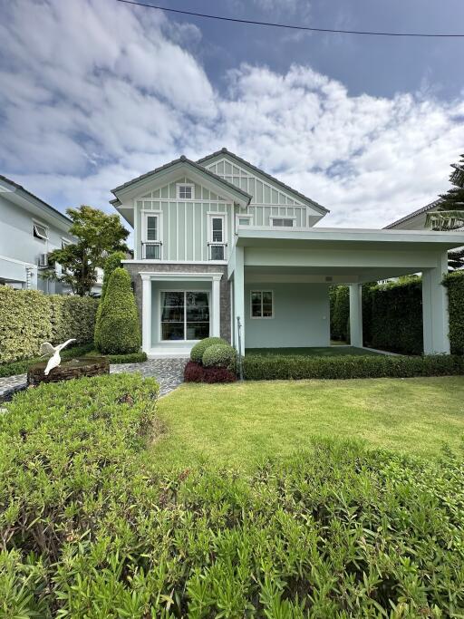 Modern two-story house with a front lawn