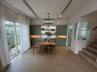 Modern dining area with a table set for a meal