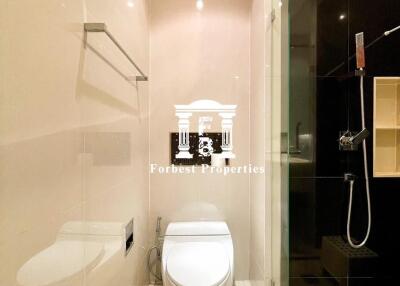 Modern bathroom with toilet and glass shower