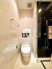 Modern bathroom with toilet and glass shower