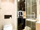 Modern bathroom with glass shower enclosure and toilet