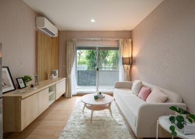 Cozy modern living room with a sofa, coffee table, and entertainment unit