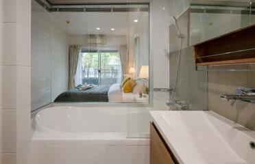 Bathroom with view into a bedroom