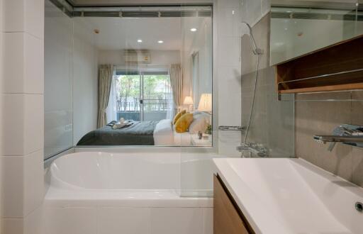 Bathroom with view into a bedroom