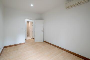 Empty bedroom with wooden flooring