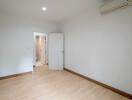 Empty bedroom with wooden flooring