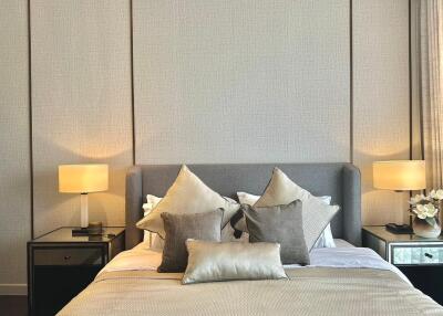 Modern bedroom with a stylish bed and bedside lamps