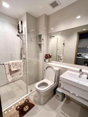 Modern bathroom with shower and large mirror