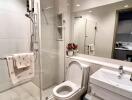 Modern bathroom with shower and large mirror