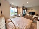 Modern bedroom with a view of the city, featuring a bed, sofa, TV, and large windows.