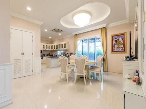 Spacious main living area with dining table and open kitchen