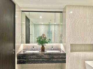 Modern bathroom with double sink and large mirror