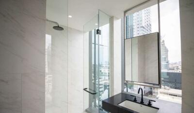 Modern bathroom with shower and city view