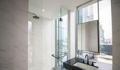 Modern bathroom with shower and city view