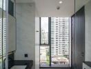 Modern bathroom with a large window and city view