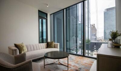 Modern living room with large window and city view