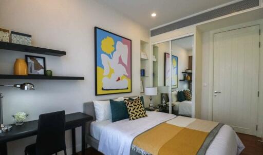 Modern bedroom with artwork and desk