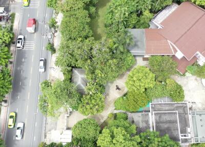 Aerial view of the property highlighting surrounding greenery and buildings