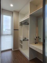 Spacious walk-in closet with shelving and hanging space