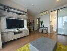 Modern living room with wooden flooring and built-in shelving