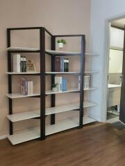 Bookshelves in the study with a view into an adjacent room