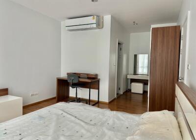 Modern bedroom with desk and air conditioning