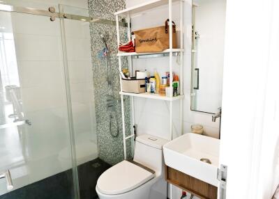 Modern bathroom with shower, toilet, and sink