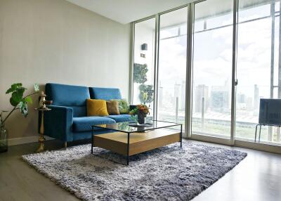 Modern living room with large windows and city view