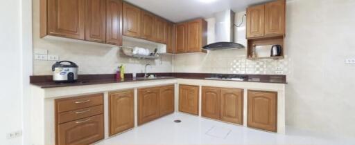 Modern kitchen with wooden cabinets and appliances