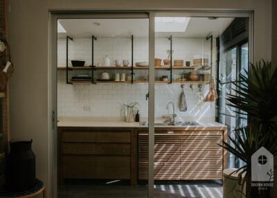 Modern kitchen with wooden cabinets and open shelves