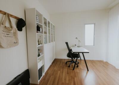 Modern home office with desk and shelving