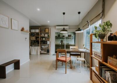 Modern dining area with wooden furniture and open shelving