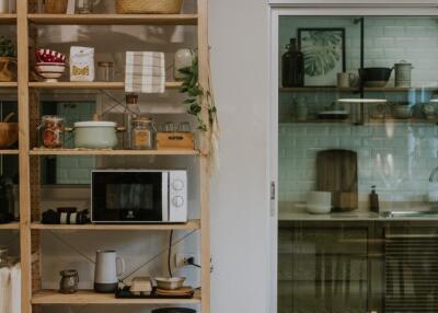 Modern kitchen with open shelving and glass door