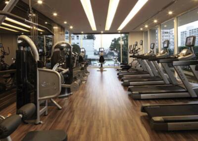 Modern gym with multiple treadmills and exercise equipment