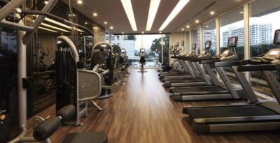 Modern gym with multiple treadmills and exercise equipment