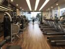 Modern gym with multiple treadmills and exercise equipment